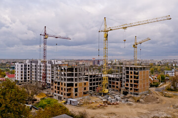Fototapeta na wymiar Tower cranes at a construction site.