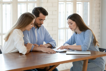 Pay attention, please. Young woman lawyer insurance agent explaining agreement contract policy...