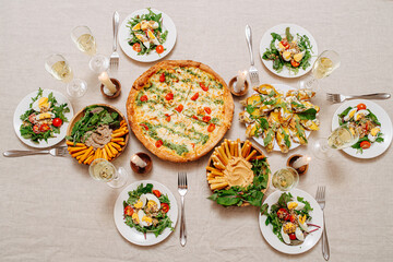 Top view of Italian cuisine assorti. Food and drinks served on a table.