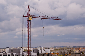 Fototapeta na wymiar Tower crane at a construction site.