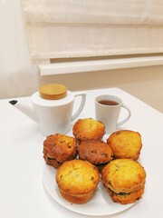 Romantic dinner in a white kitchen by candlelight.