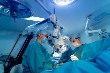 Medical instruments in surgeon's hands. Operating process in hospital. Doctors performing operation with surgery tools.