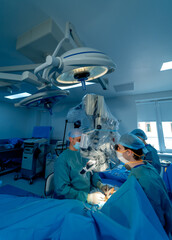 Professional doctors with surgical instruments. Surgeons in sterile gloves work with modern medical...