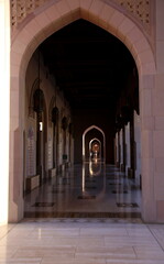Fototapeta na wymiar Perspective view of the portico of the Sultan Qaboos Grand Mosque, Muscat, Oman