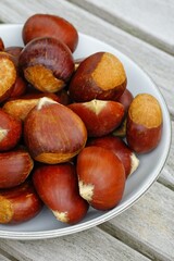 Bowl of fresh chestnuts in the shell in winter