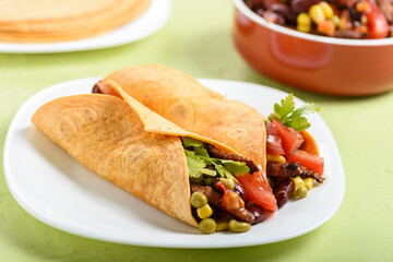 Tacos - delicious tortillas with meat and vegetables