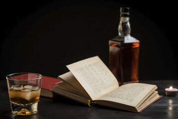 a glass of whiskey and a good book