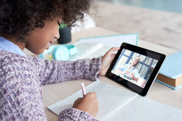 Fototapeta na wymiar African kid child girl holding digital tablet talking with remote teacher tutor on social distance video conference call elearning online virtual class. Children learning at home, over shoulder view.