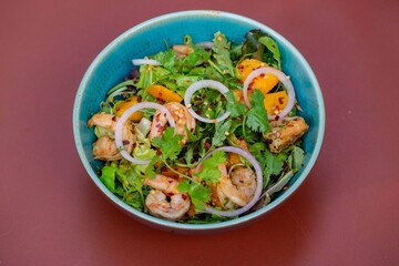 prawn salad with fresh mango fruit on a bowl