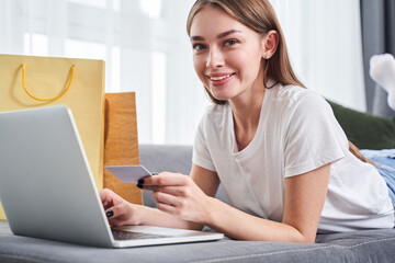 Girl holding credit card