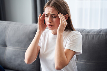 Girl feeling pain in head