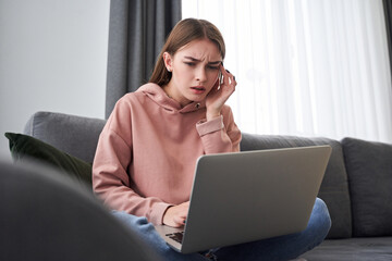 Woman tightens the skin near her eyes