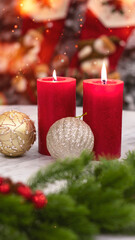 Christmas toys close-up, blurred bokeh background. Christmas background for a postcard. Spruce branches, cones, Christmas balls. Box with a gift and a red bow.