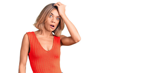 Beautiful caucasian woman wearing casual clothes surprised with hand on head for mistake, remember...