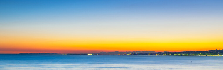 Nightview scenic of the coastline of nice with a beautiful twilight with pink tone