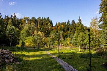 Countryside resting place with beautiful nature. Plank path and lanterns
