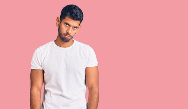 Young latin man wearing casual clothes depressed and worry for distress, crying angry and afraid. sad expression.