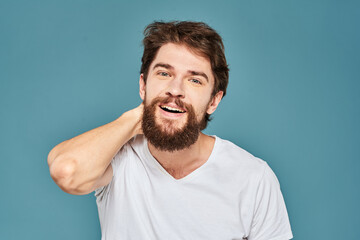 emotional man gesturing with hands lifestyle fun white t-shirt blue isolated stock