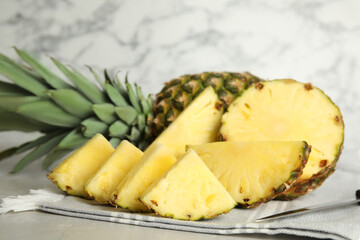 Fototapeta na wymiar Slices of fresh juicy pineapple on table