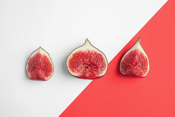 Delicious ripe figs on color background, flat lay