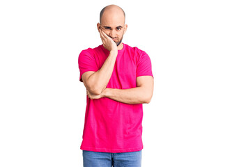 Fototapeta premium Young handsome man wearing casual t shirt thinking looking tired and bored with depression problems with crossed arms.