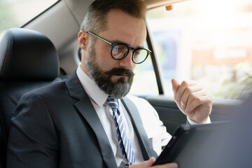 portrait of a businessman in car