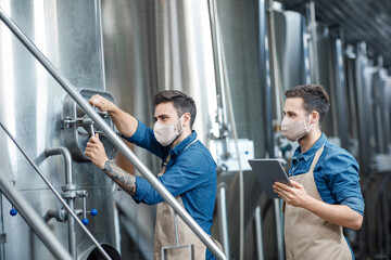 Fototapeta na wymiar Beer production at factory during covid-19 epidemic