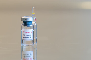 A closeup vial of COVID-19 Coronvavirus live virus biohazard culture - 078