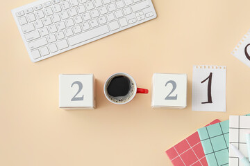 Composition with figure 2021 and cup of coffee on color background