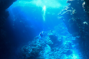 Male scuba diver in underwater cavern