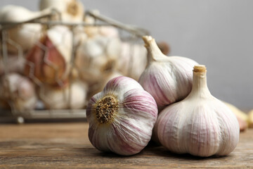 Fresh organic garlic on wooden table, closeup