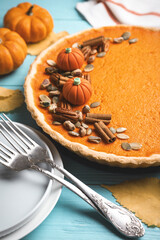 Delicious homemade pumpkin pie on light blue wooden table
