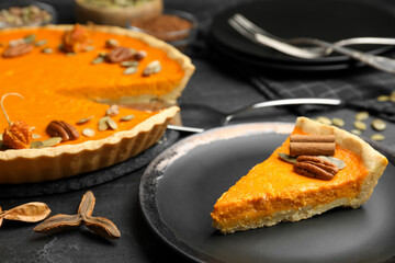 Delicious homemade pumpkin pie on black table