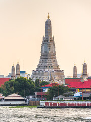 Chao Phraya River and Wat Arun, The Temple of Dawn, an Important Buddhist Temple and a Famous Tourist Destination in Bangkok Yai District of Bangkok, Thailand.