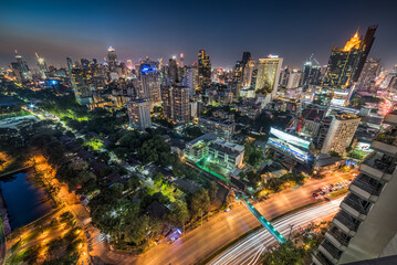 Fototapeta na wymiar Panoramic View of Bangkok, Thailand. Cityscape with Public Park and Skyscrapers at Twilight.