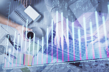 Double exposure of man and woman working together and forex graph hologram drawing. Financial analysis concept. Computer background. Top View.