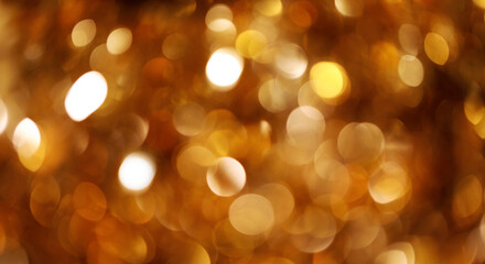 Fototapeta premium Golden blurry bokeh shining lights, sparkling shiny Christmas lights