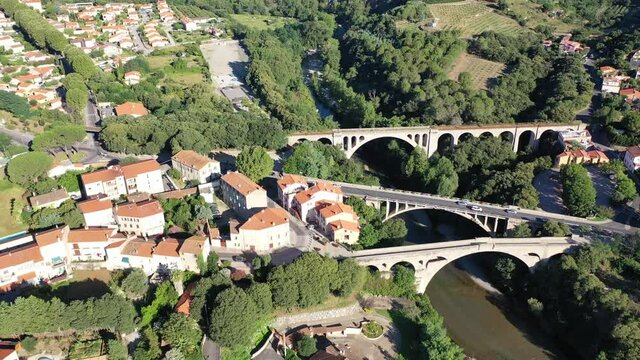 Flight over the city Ceret on summer day. France