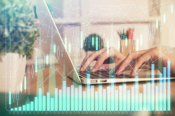 Double exposure of woman hands typing on computer and forex chart hologram drawing. Stock market invest concept.