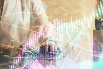 Obraz premium Double exposure of woman hands typing on computer and forex chart hologram drawing. Stock market invest concept.
