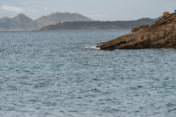 beach and bay of vigo landscape with the cies islands