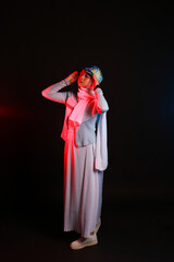 Obraz na płótnie Canvas Fashion portrait of young beautiful asian muslim woman with wearing hijab.