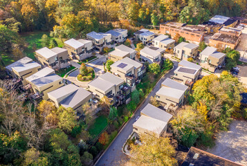 Aerial view of contemporary, modern duplex multistory houses, in a regentrified neighborhood, with...
