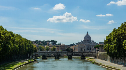 Fototapeta na wymiar River tiber in rome italy with st peters basilica in the background during sunny day.