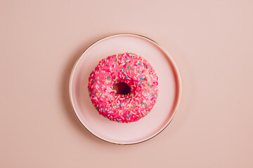 Donuts on pink background. Minimal concept. Top view