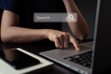 Woman using laptop for searching with browser hologram effect.