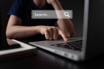 Woman using laptop for searching with browser hologram effect.