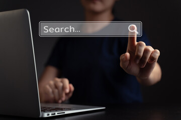 Woman using laptop for searching with browser hologram effect.