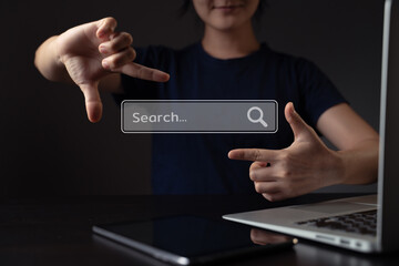 Woman using laptop for searching with browser hologram effect.