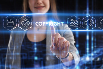 Business, Technology, Internet and network concept. Young businessman working on a virtual screen of the future and sees the inscription: Copyright